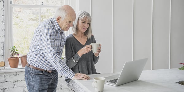 Man and woman in front of a computer